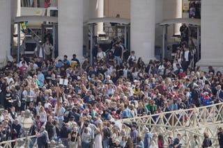 People arrive at St Peter's Square at the Vatican